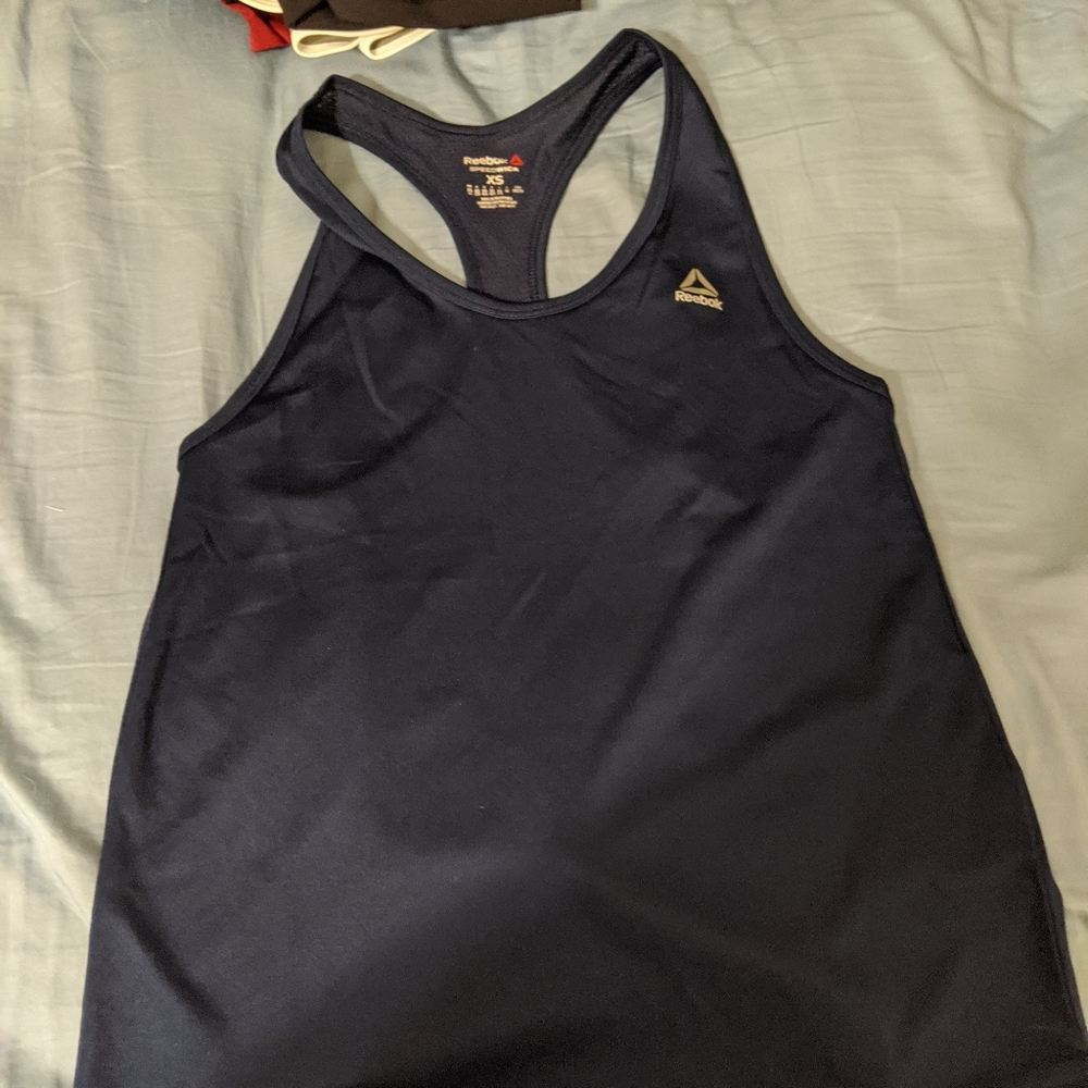 Dry fit Reebok tank top. Flattering cut  dark blue